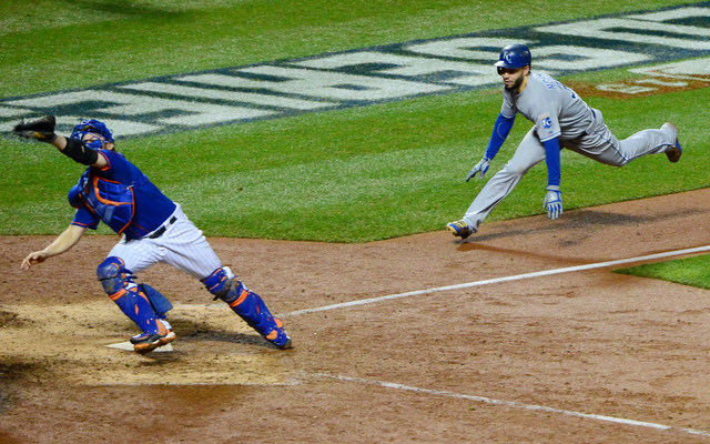 Nov 1, 2015; New York City, NY, USA; Kansas City Royals first baseman Eric Hosmer (35) score the tying run past New York Mets catcher Travis d'Arnaud (7) in the 9th inning in game five of the World Series at Citi Field. Mandatory Credit: Jeff Curry-USA TODAY Sports